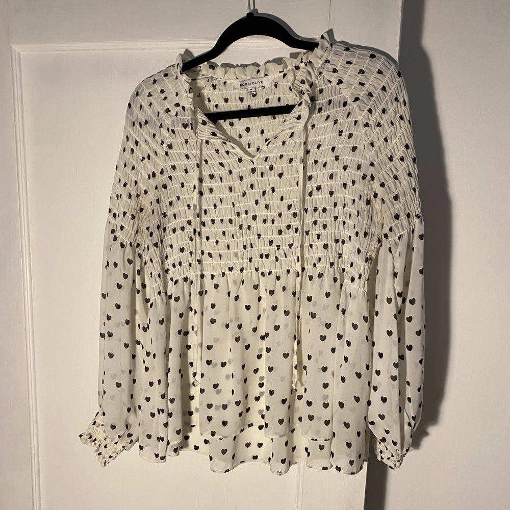 Cream colored smock top with black heart pattern